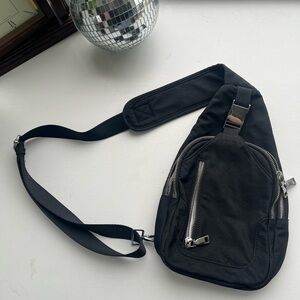 Black Sling Bag with buckle and zippers and clasps Black Adjustable Cargo Bag